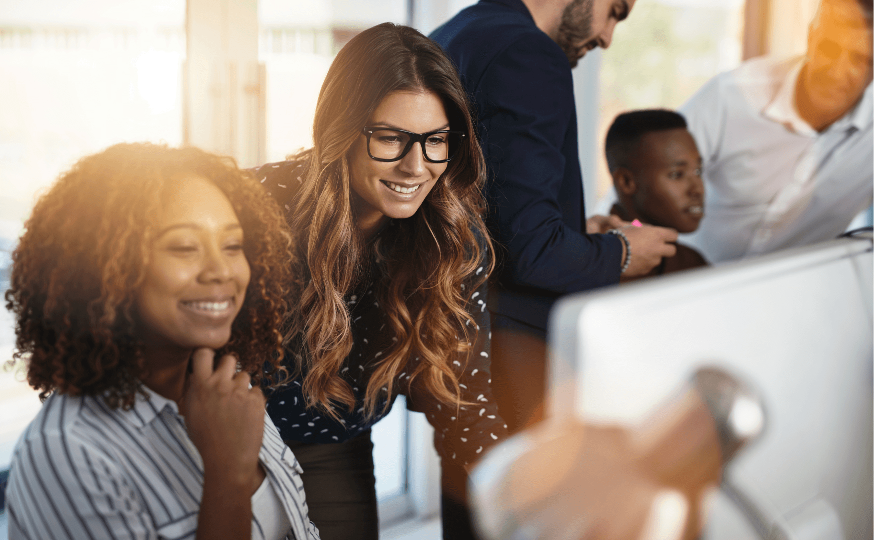 A diverse team of business professionals collaborating on AI strategy